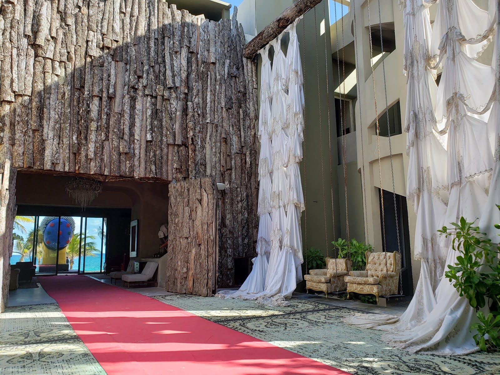 Artistic installation with tree trunk walls