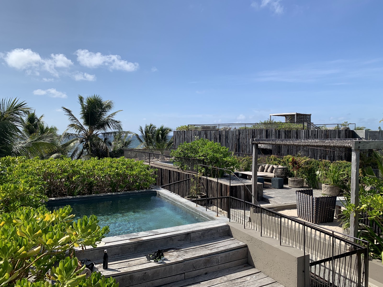 Pool deck overlooking the sea at Be Tulum