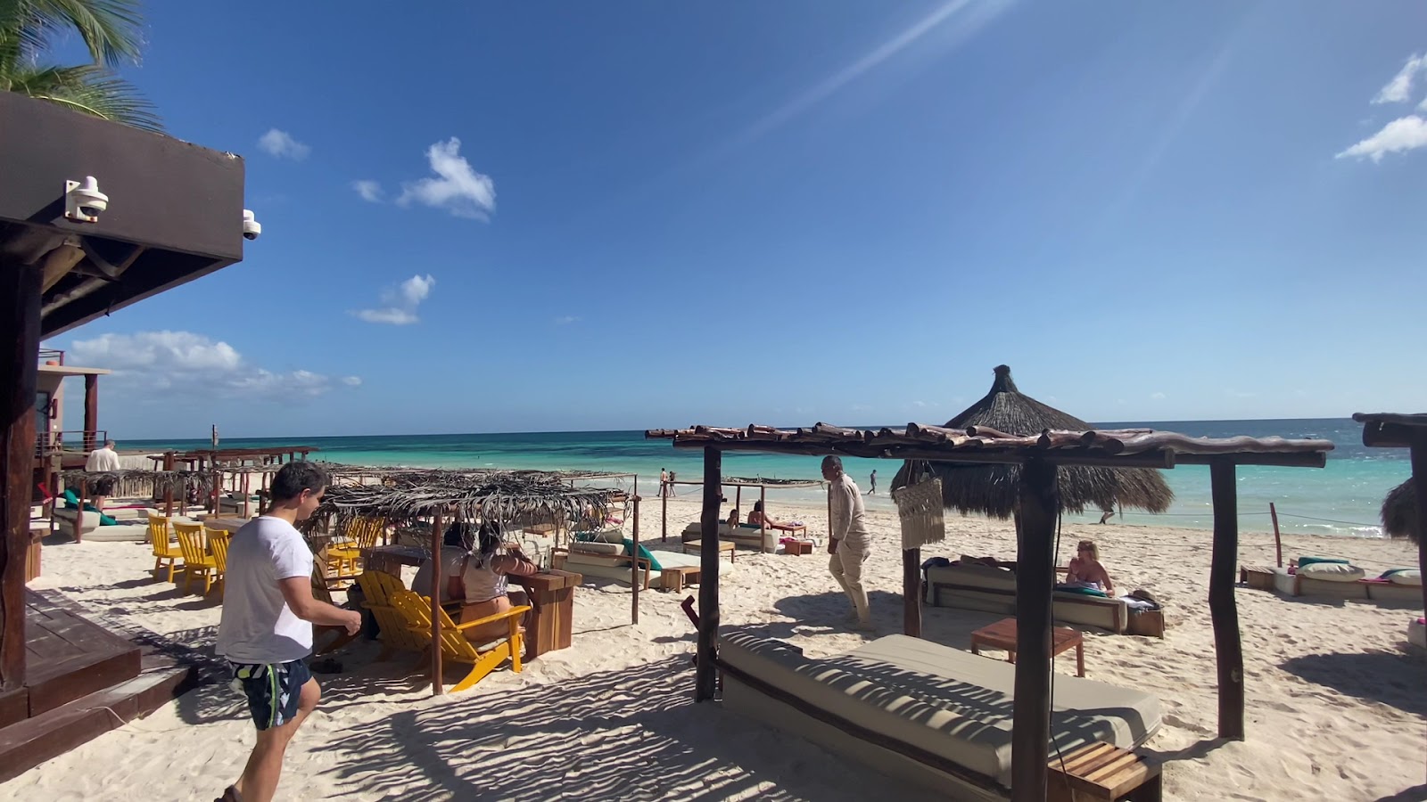 Beachfront lounge with a thatched umbrella