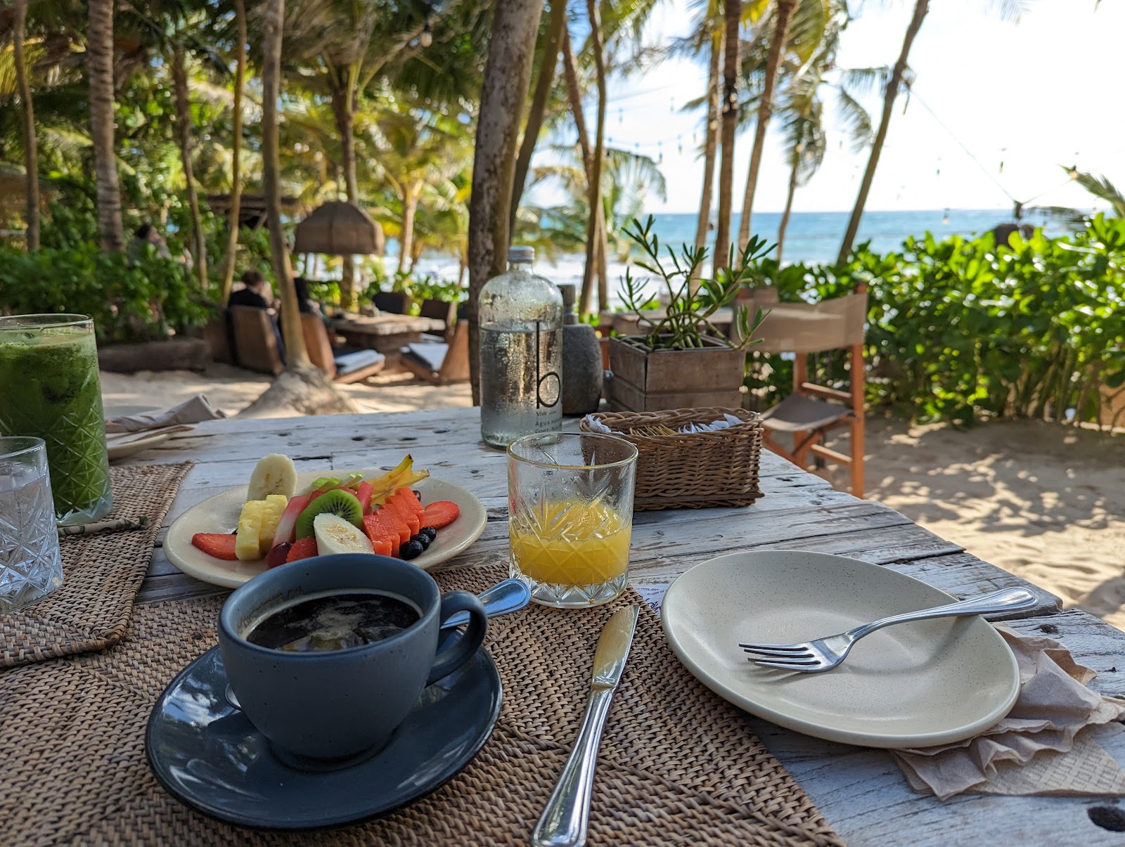 Breakfast served on a table by the beach