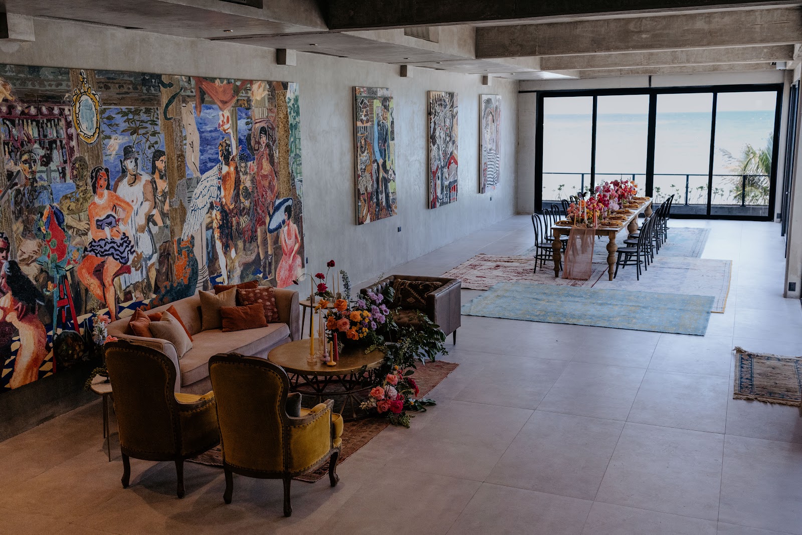 Art-filled lounge with colorful paintings at Casa Malca