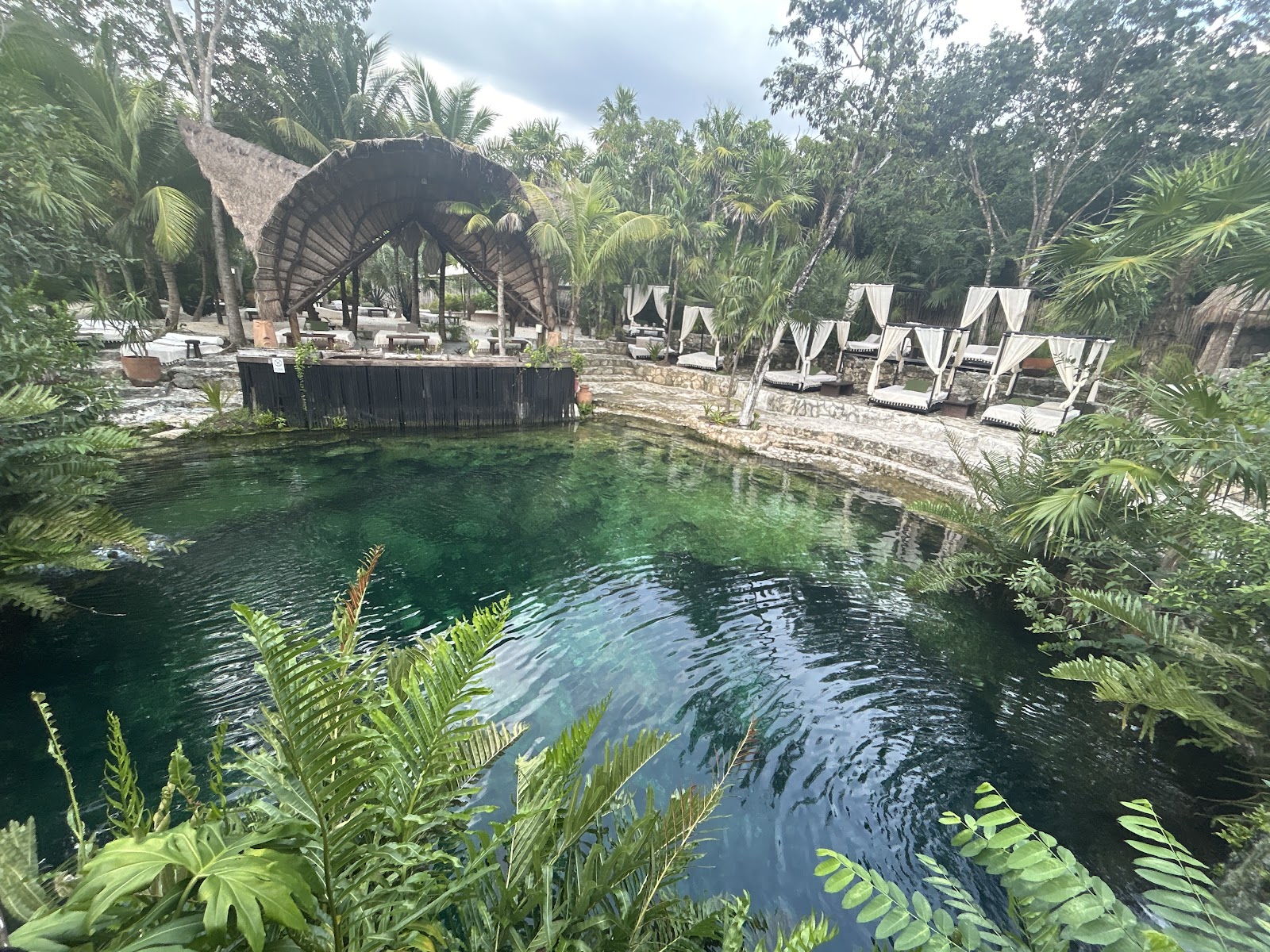Cenote pool with loungers around the water