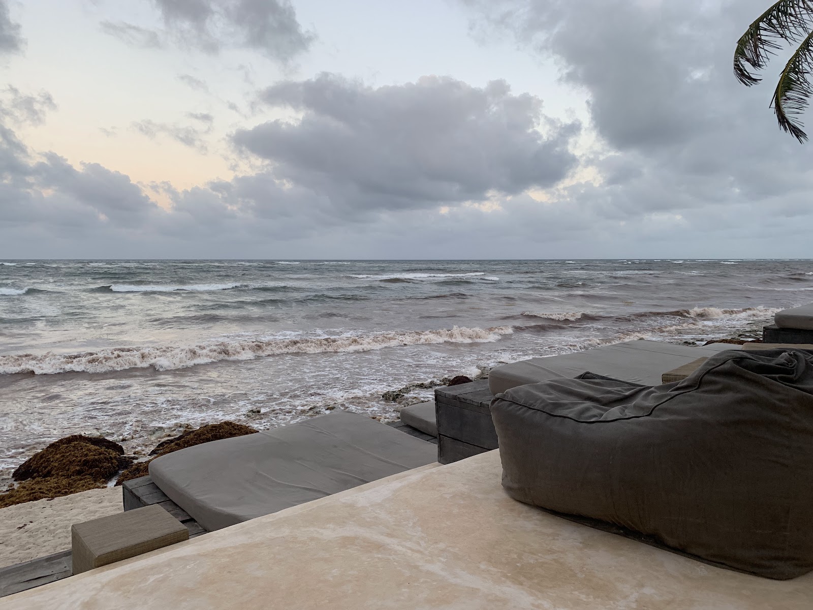 Cloudy day over the beach loungers in Tulum
