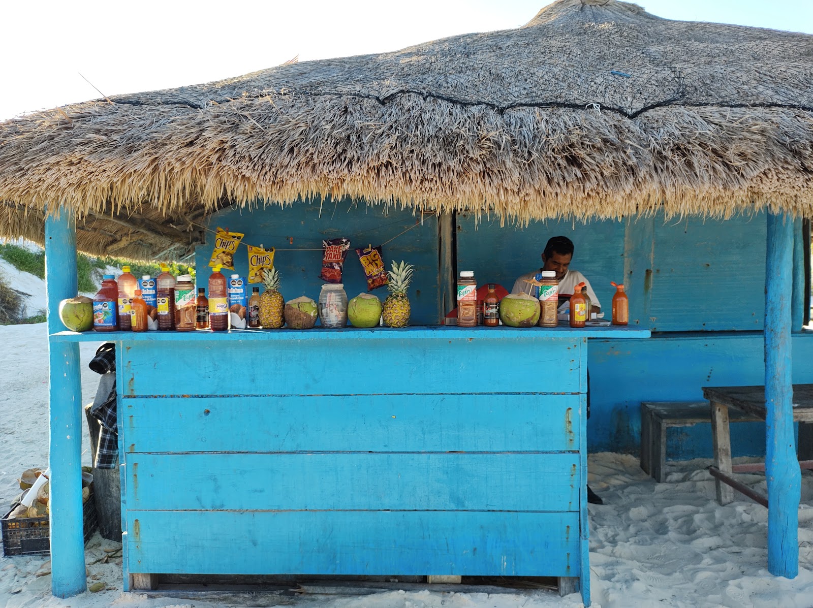 Colorful beach bar with drinks on display
