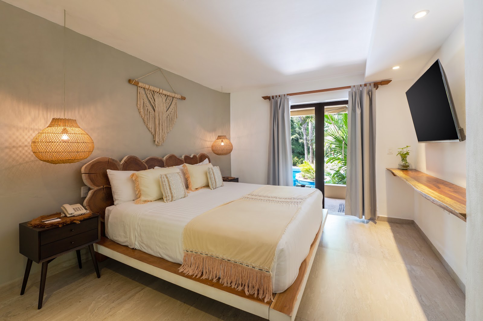 Contemporary guest room with neutral decor and pendant lamp