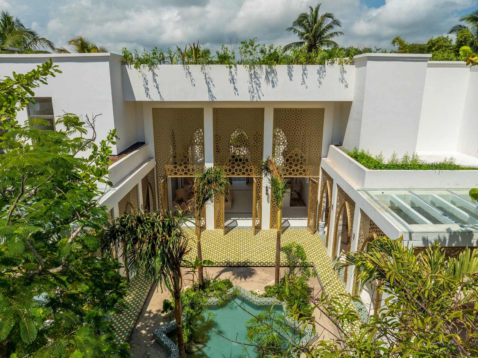 Courtyard filled with tropical plants and greenery