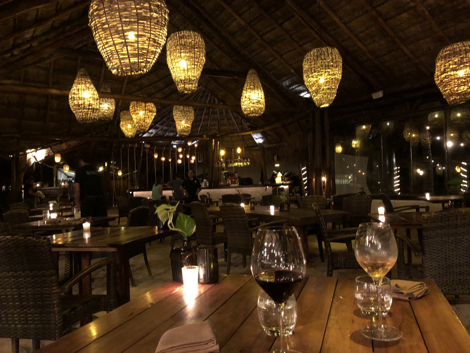 Dimly lit dining room with hanging lanterns