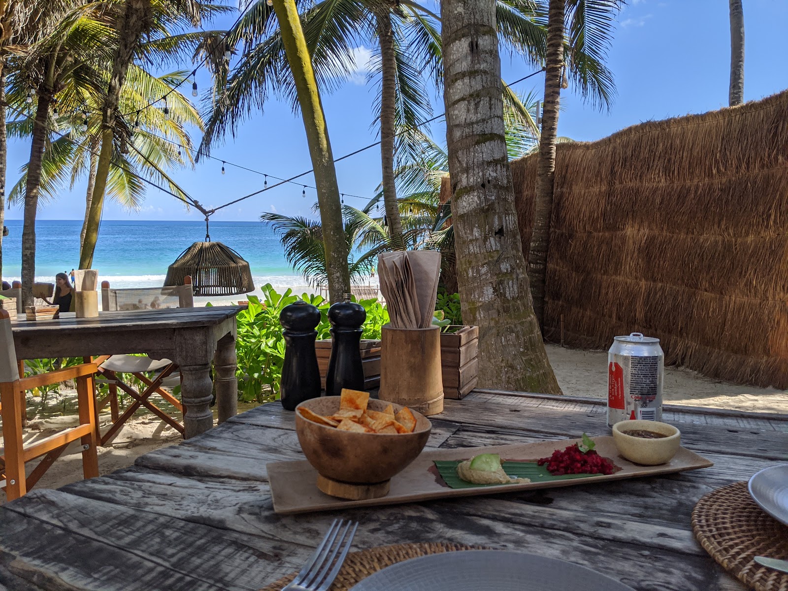 Drinks on a wooden table under the palms
