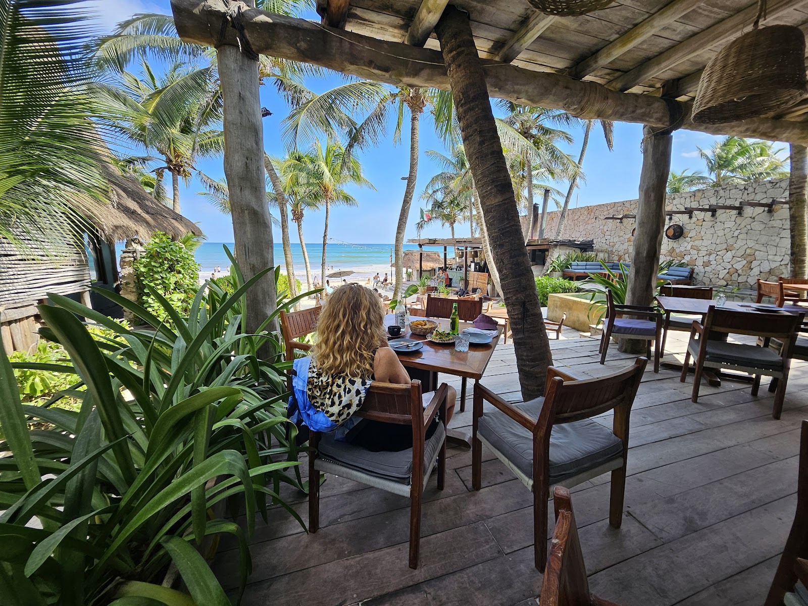 Guest dining on a terrace with sea views