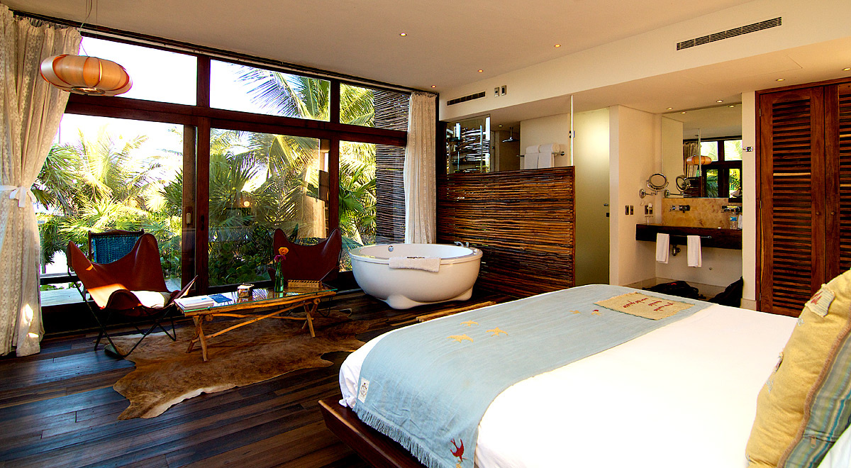 Bright guest room with crisp white bedding
