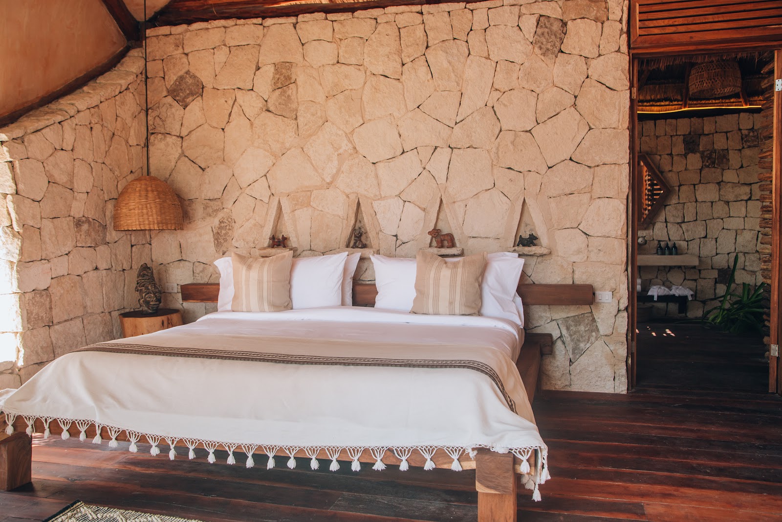 IKAL Tulum guest room with crisp white bedding