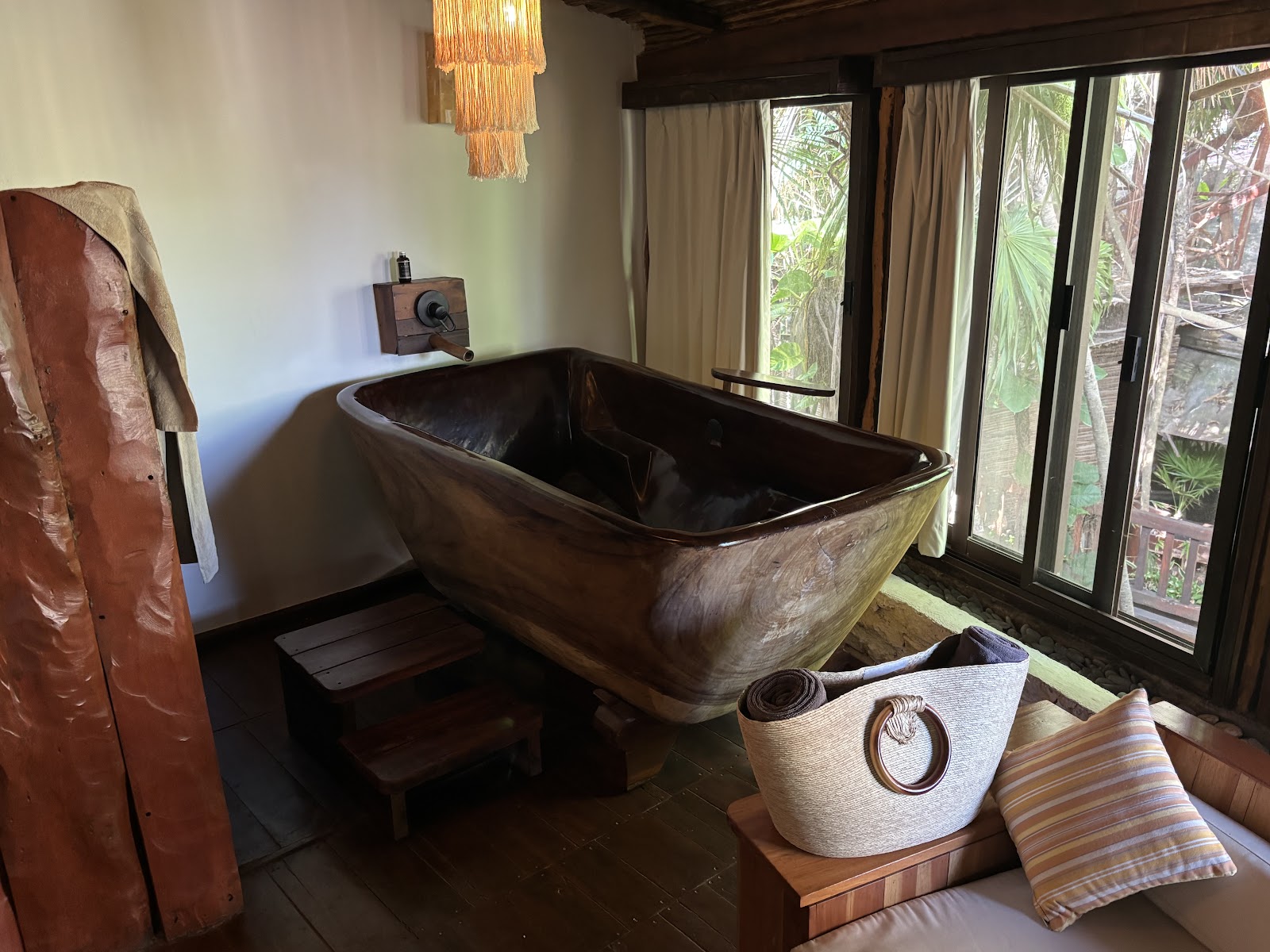 Kanan Tulum suite with a wooden bathtub