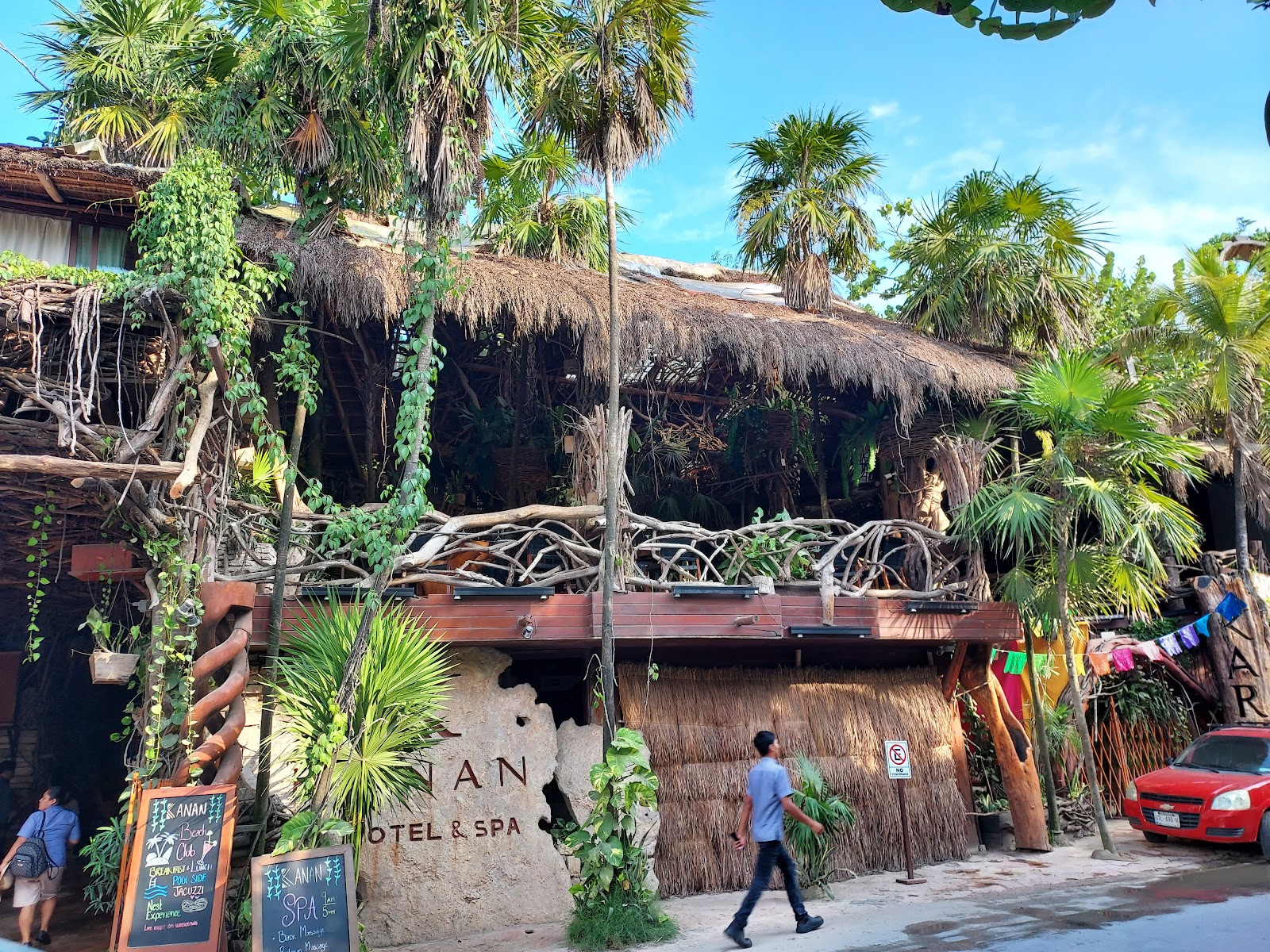 Kanan Tulum thatched jungle buildings among palm trees