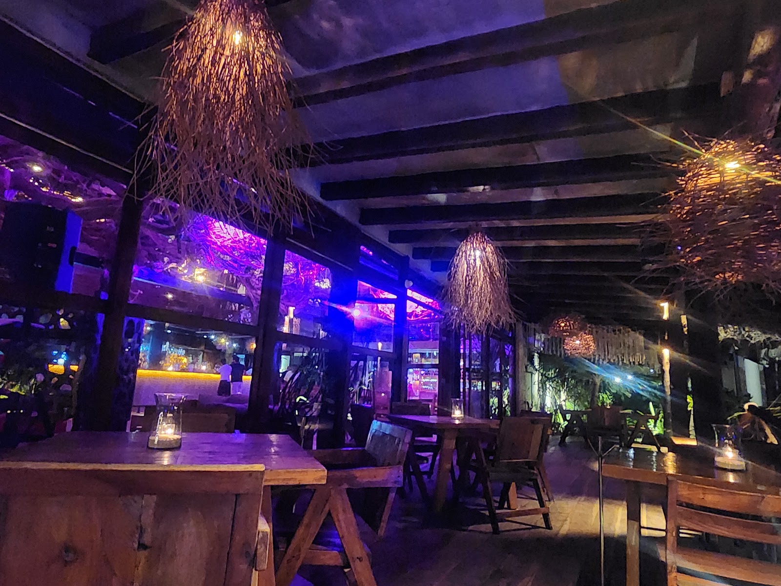 Mia Beach Club lit in purple at night