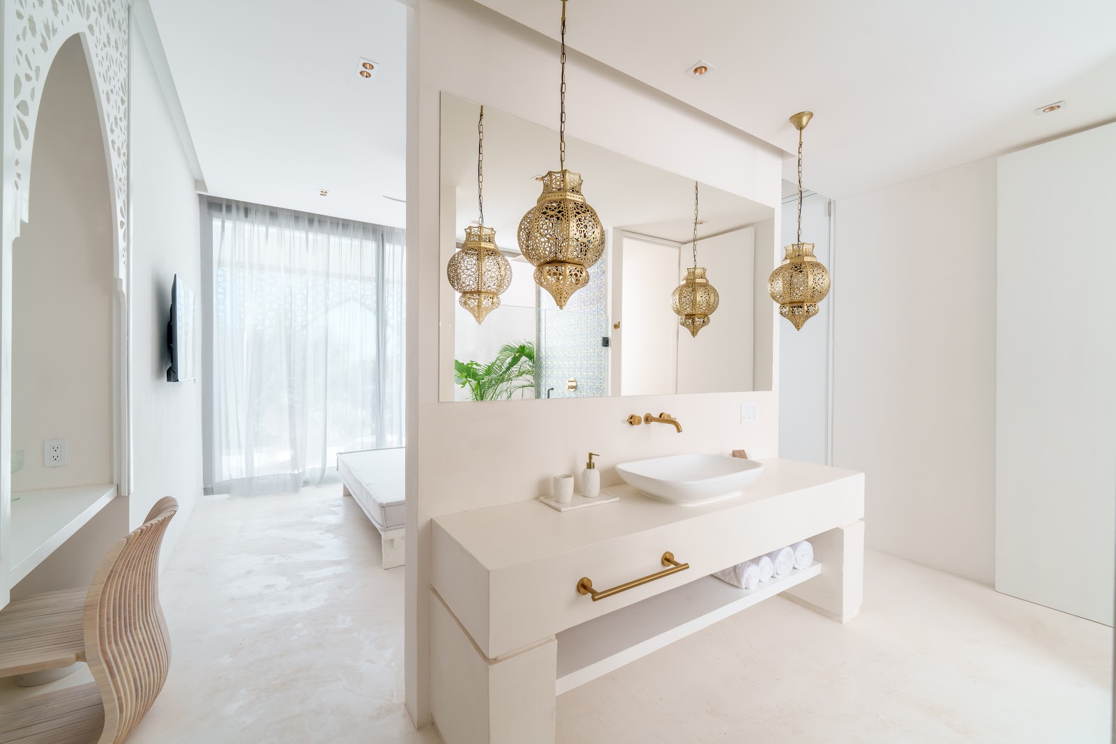 Minimalist vanity area with hanging lanterns