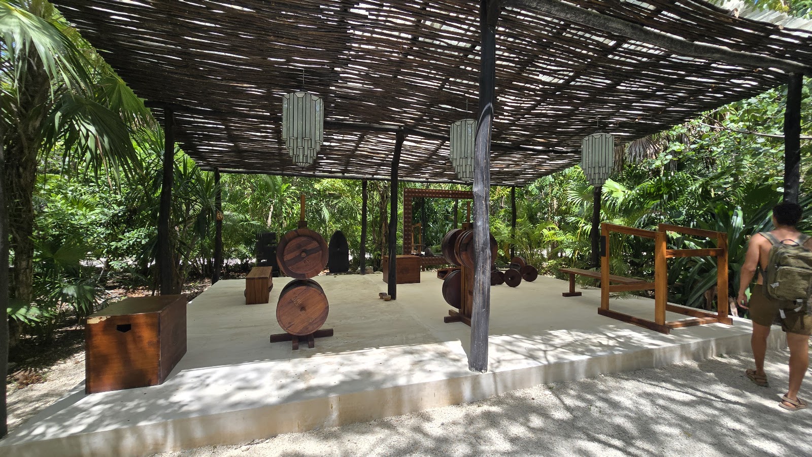 Open-air pavilion under a wooden pergola