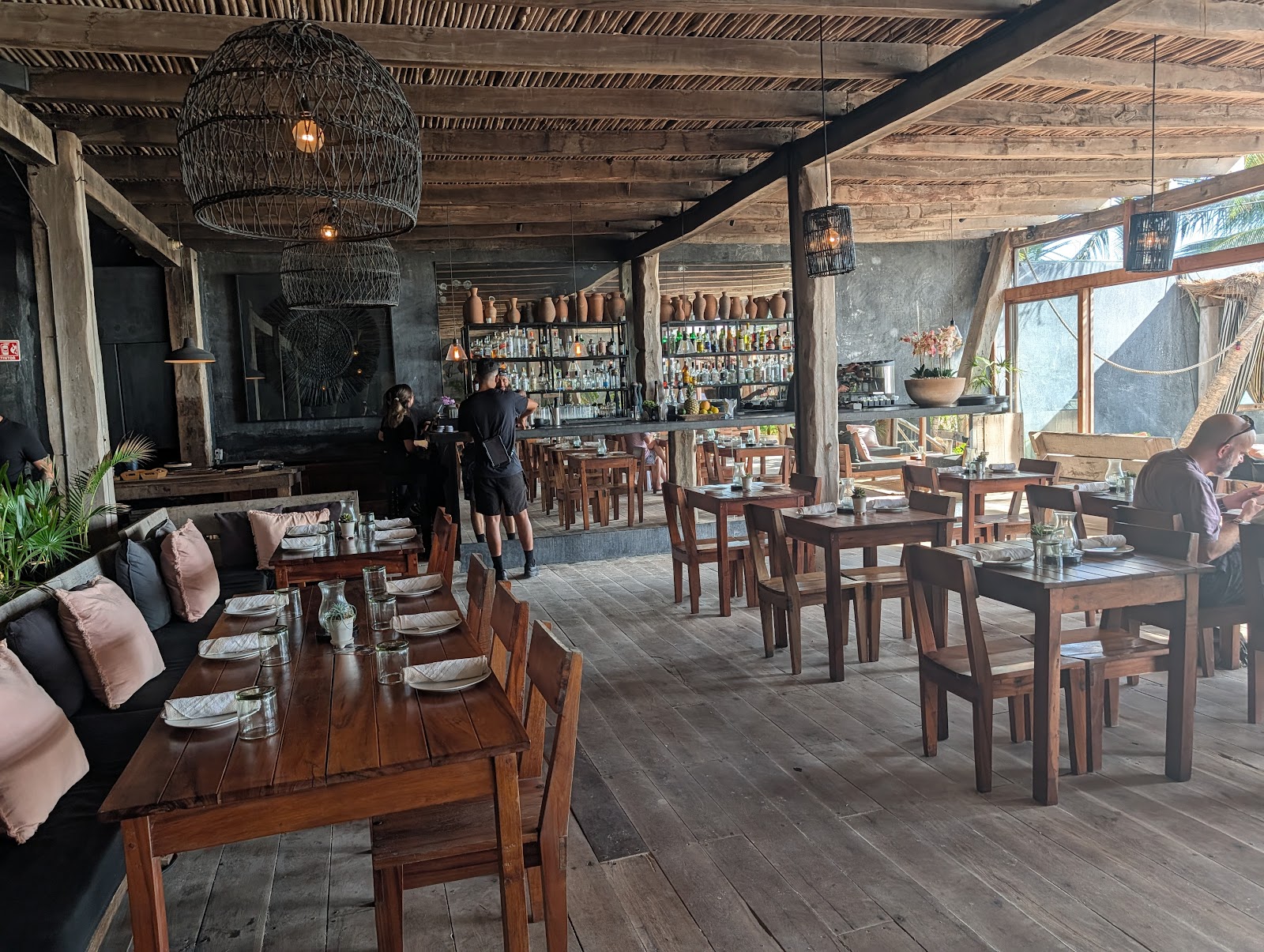 Open-air restaurant with rattan chairs