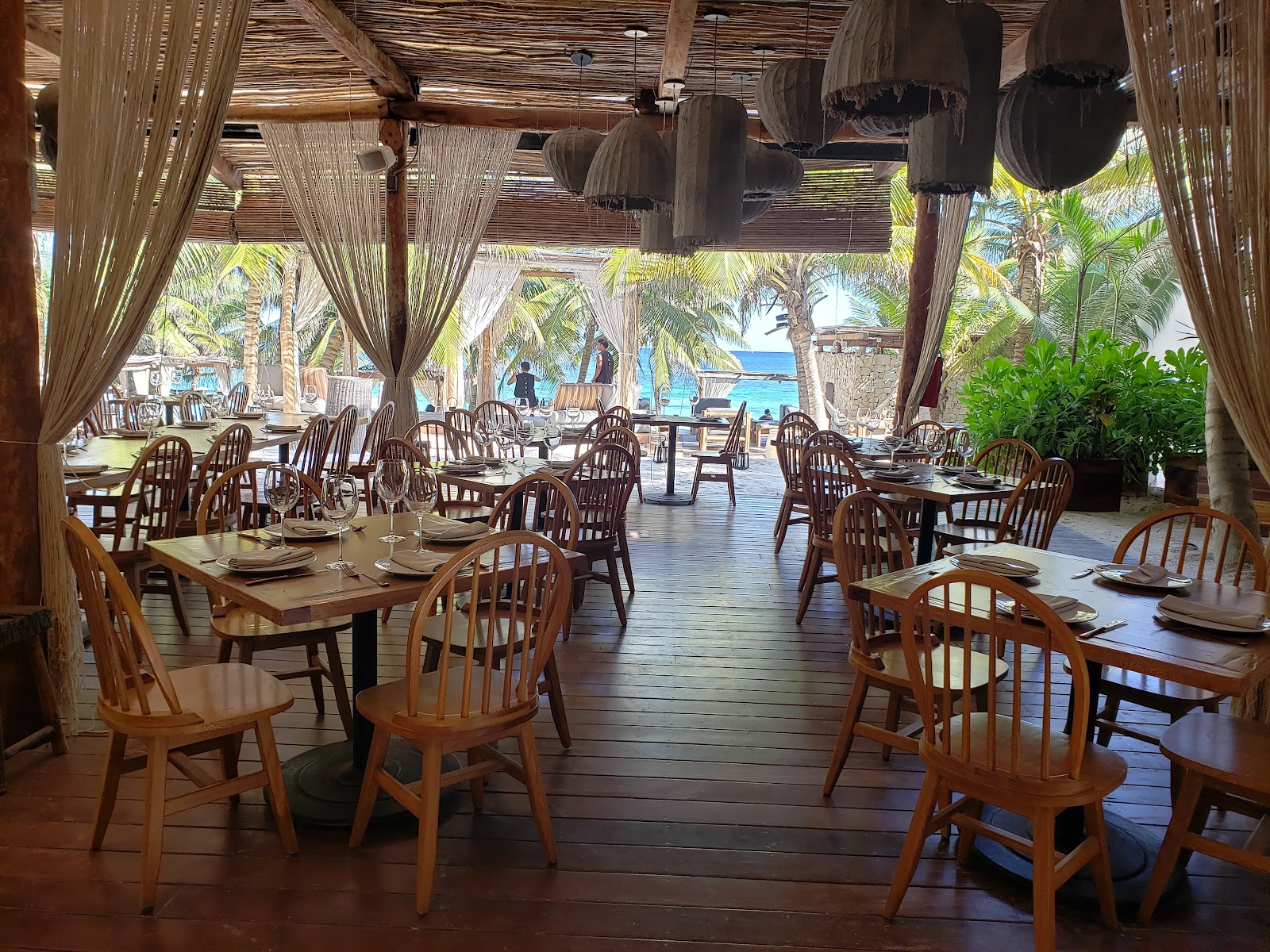 Neatly arranged tables in the open-air restaurant