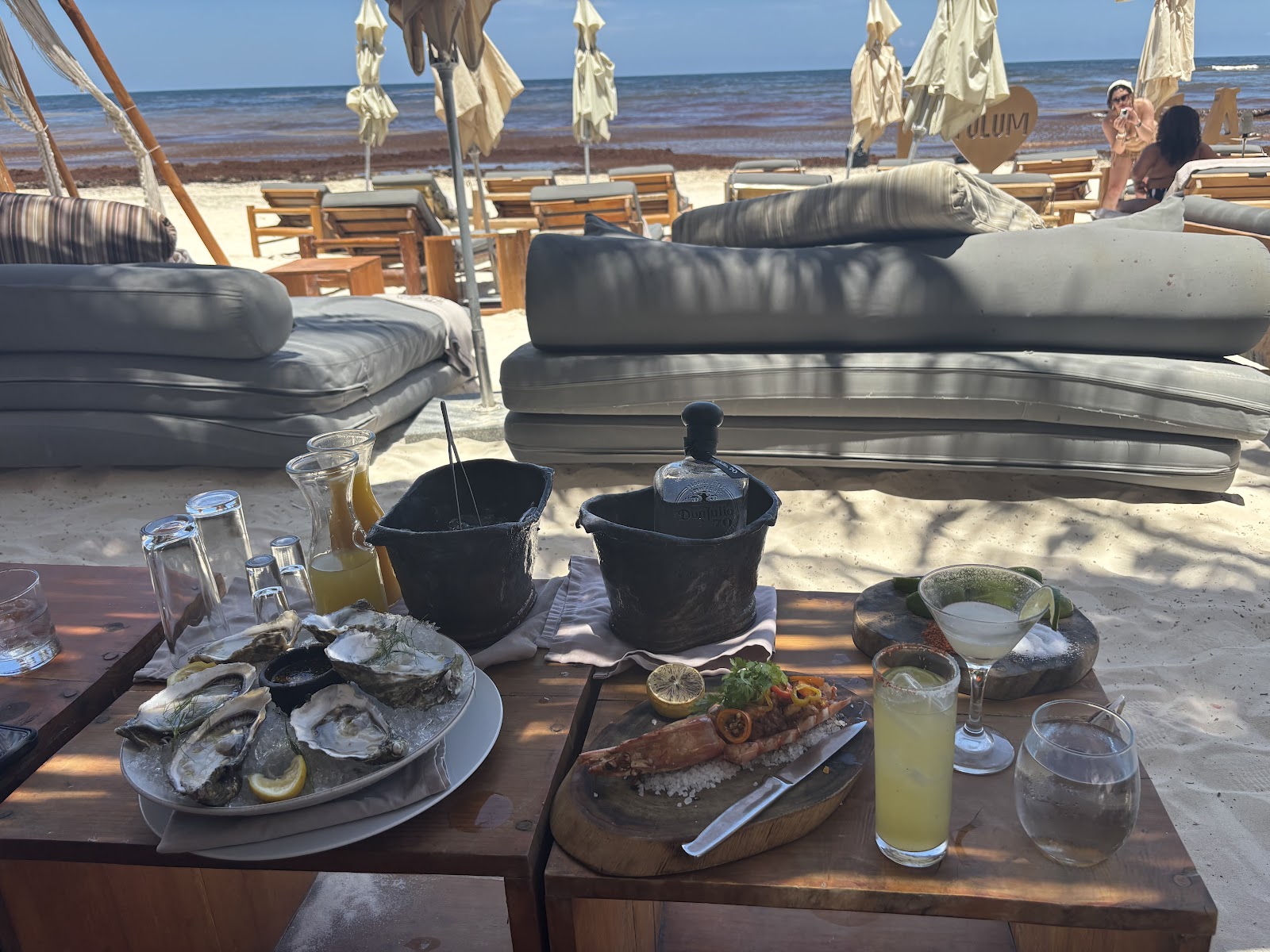 Oysters and drinks served at a beach lounge