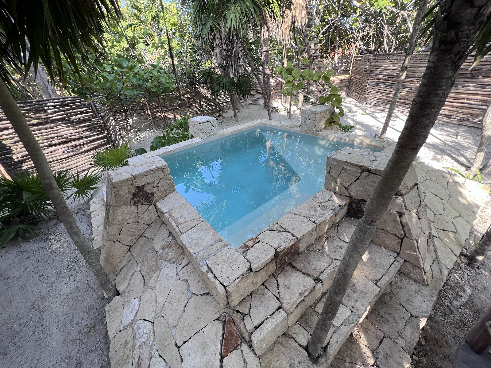Plunge pool in a private stone courtyard