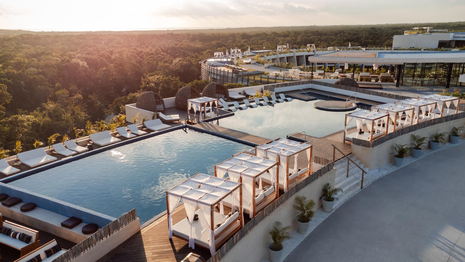 Pool deck with sunbeds at sunset