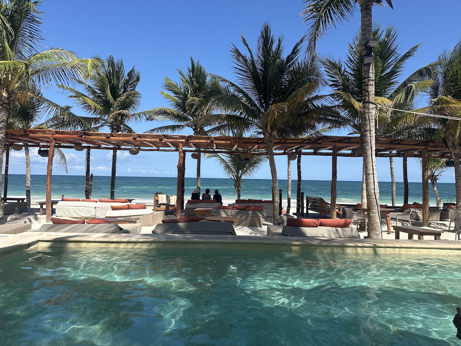 Pool with loungers overlooking the sea