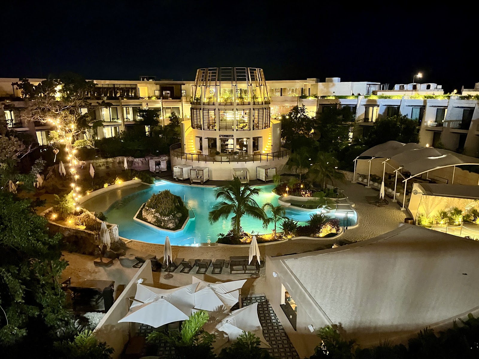 Resort pool lit up at night
