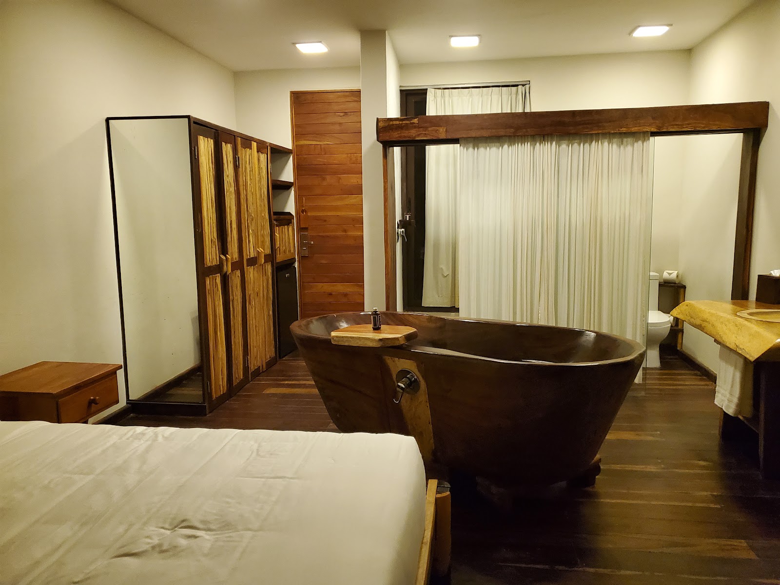 Room with a freestanding stone bathtub
