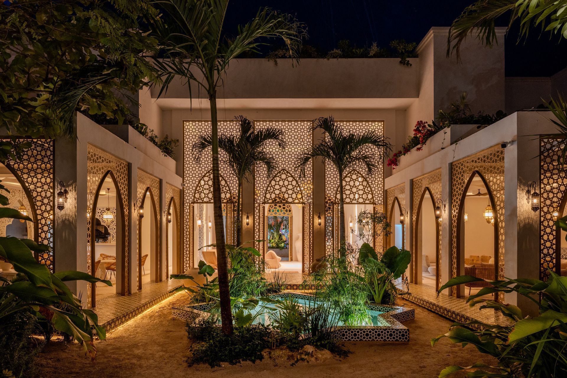 Candlelit Moroccan courtyard at Sana Tulum in the evening