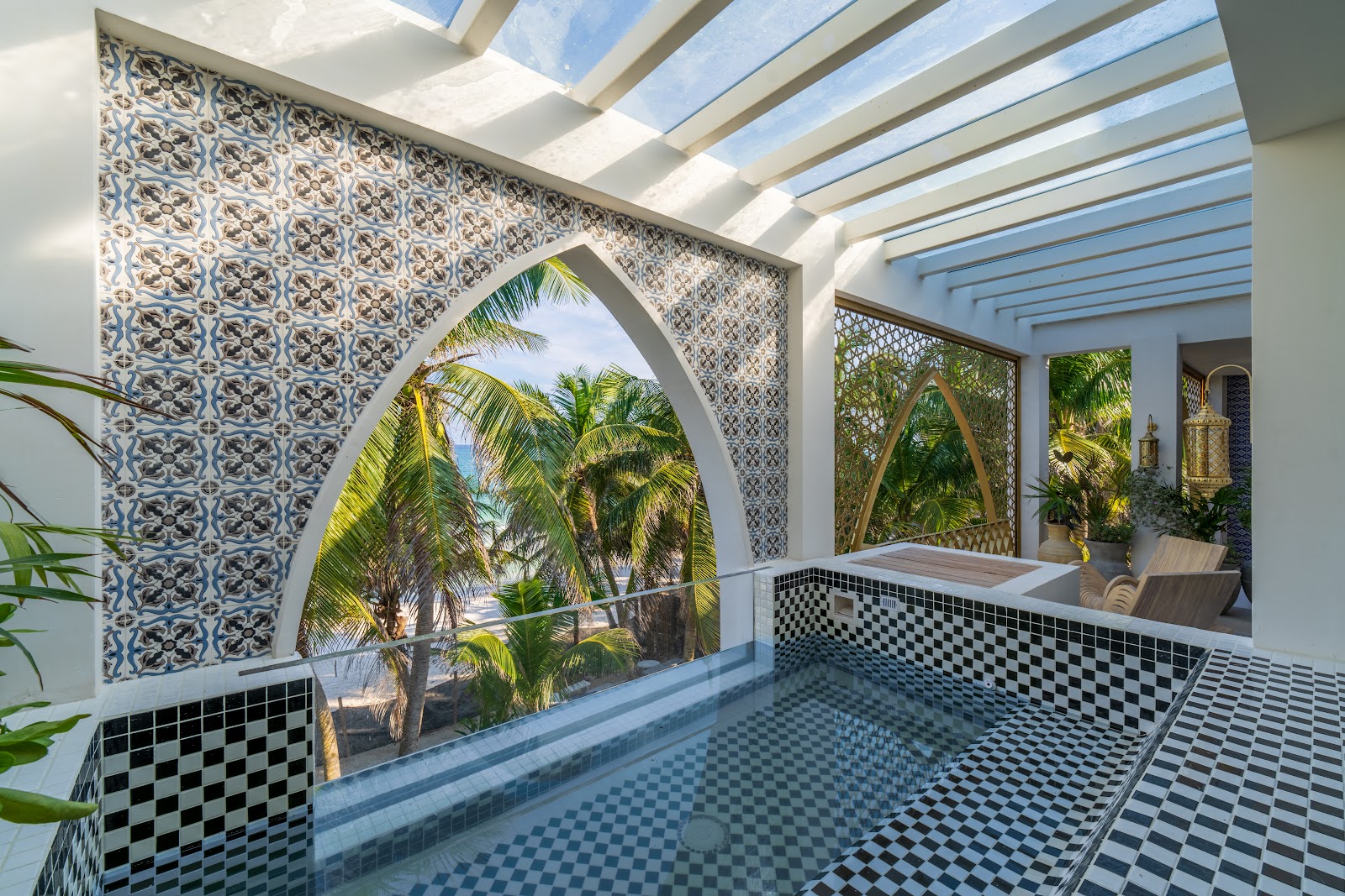 Sana Tulum daybed area behind a Moroccan lattice screen