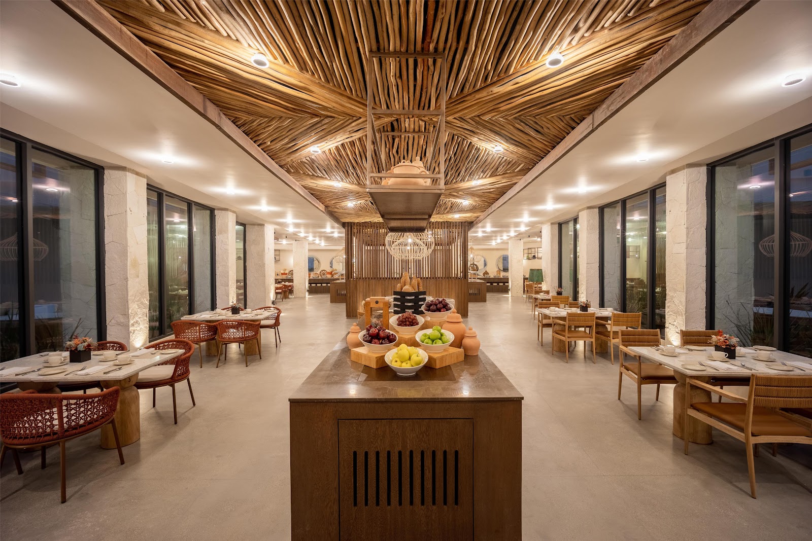 Secrets Tulum restaurant interior with long dining tables