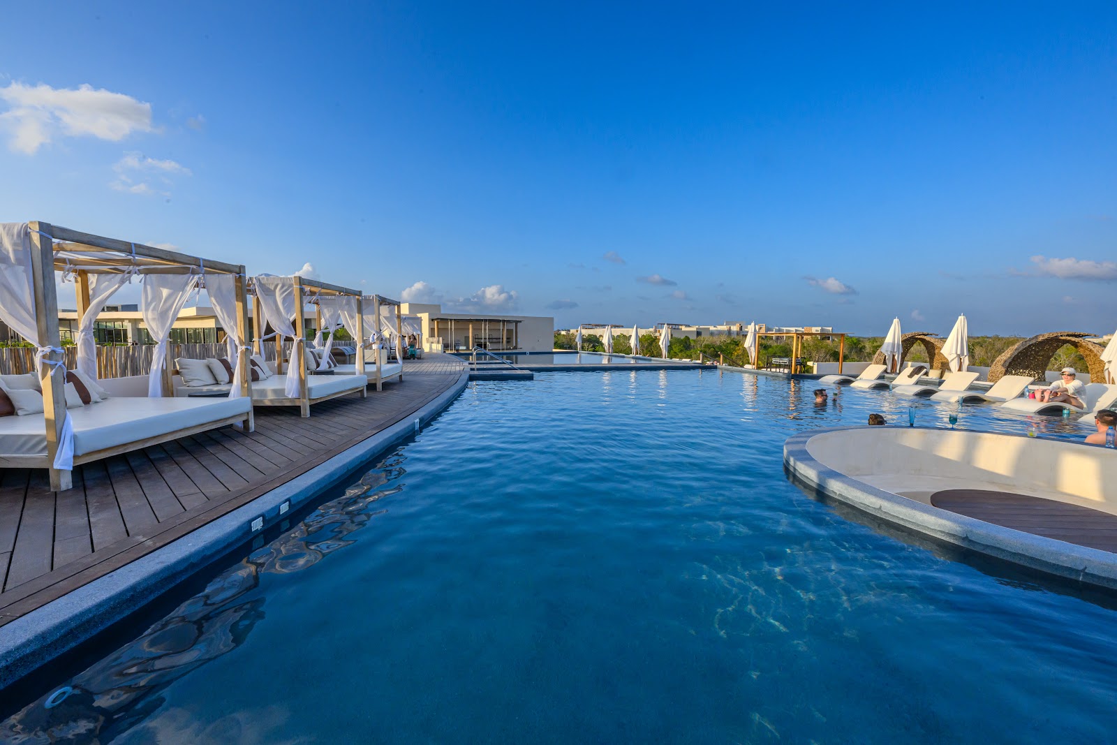 Rooftop infinity pool with daybeds at Secrets Tulum