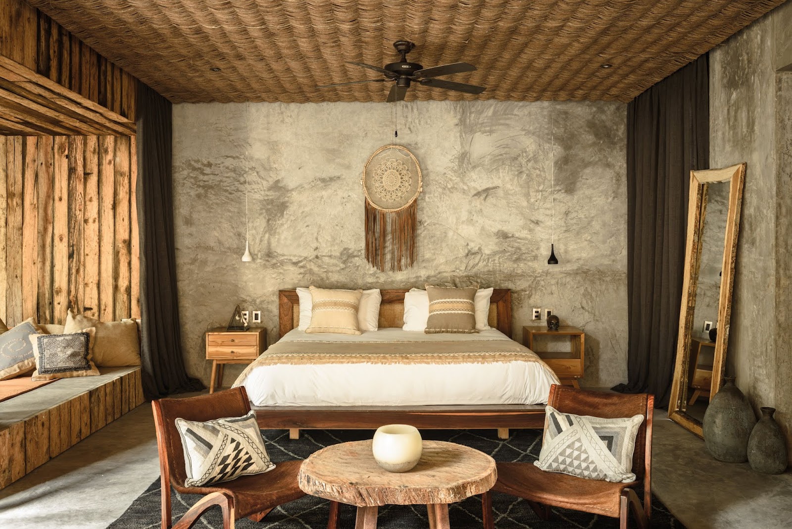 Suite with a large bed and natural textures