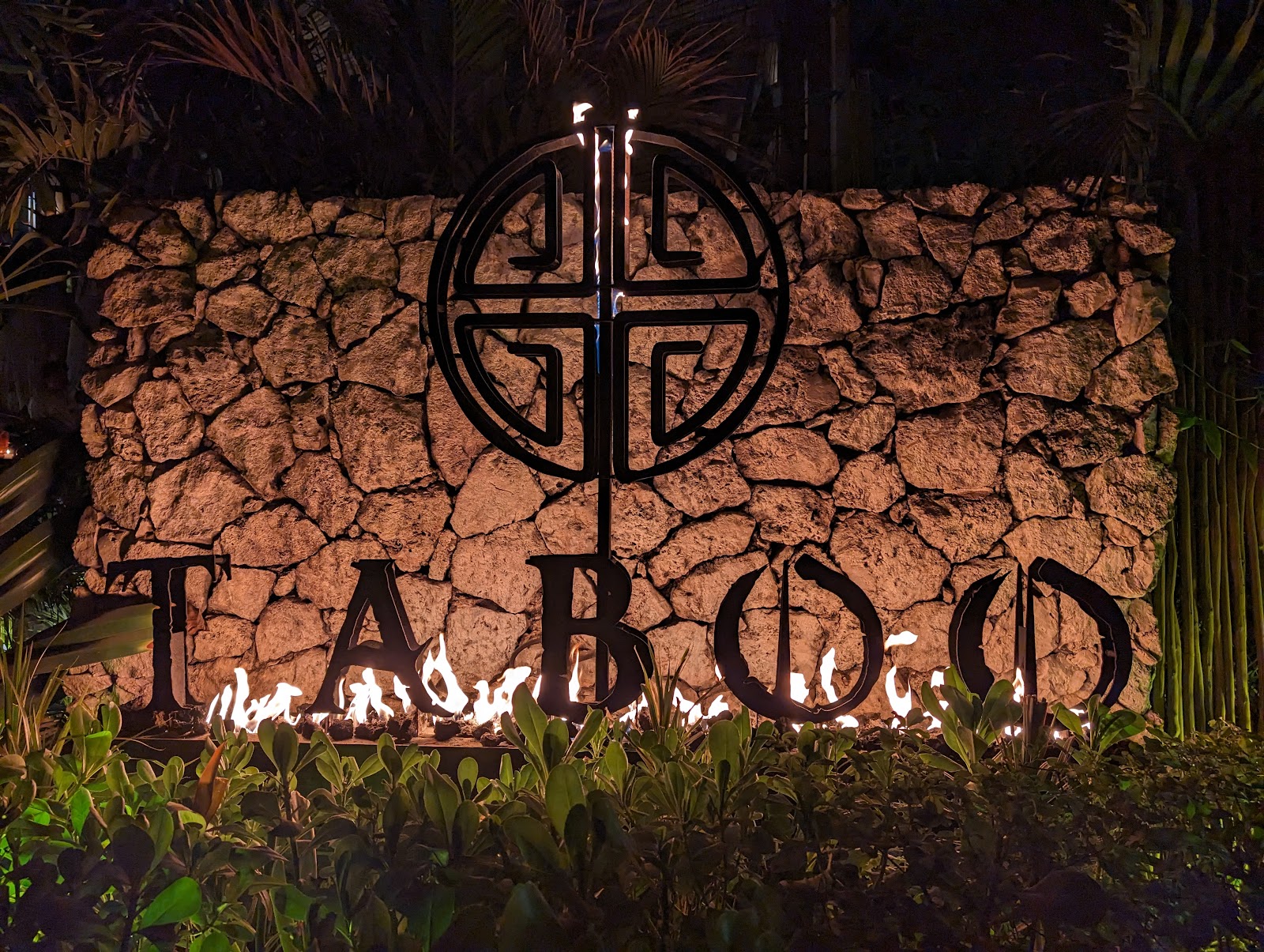 Taboo Tulum sign glowing at night
