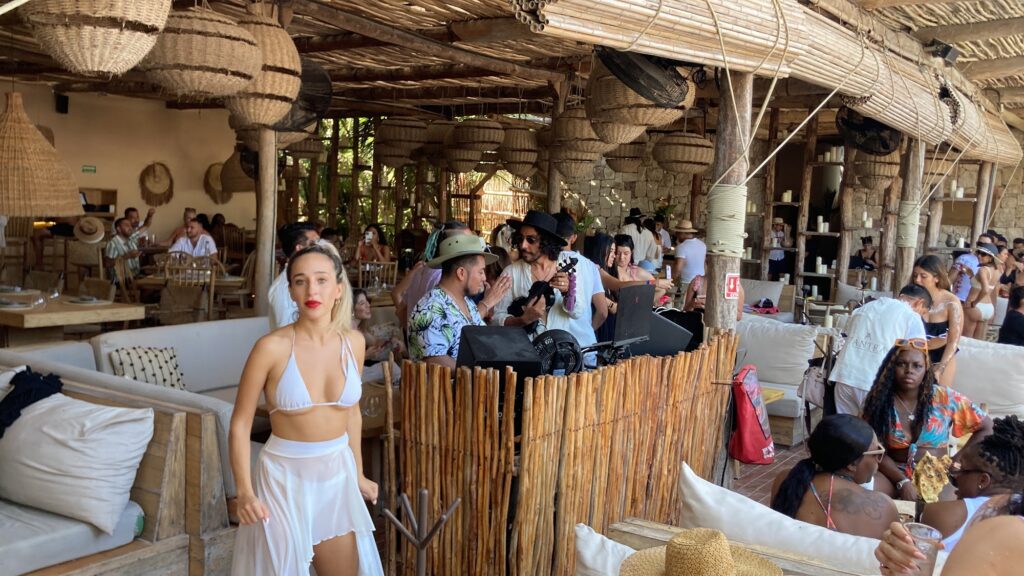 Busy lounge area filled with guests at Tantra Beach Club