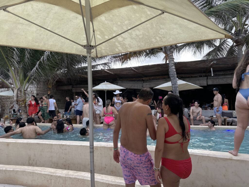 Crowd enjoying a pool party at Tantra Beach Club