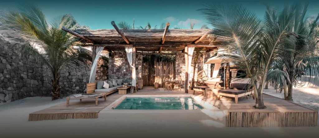 Private pool villa surrounded by palms at Tantra Beach Club