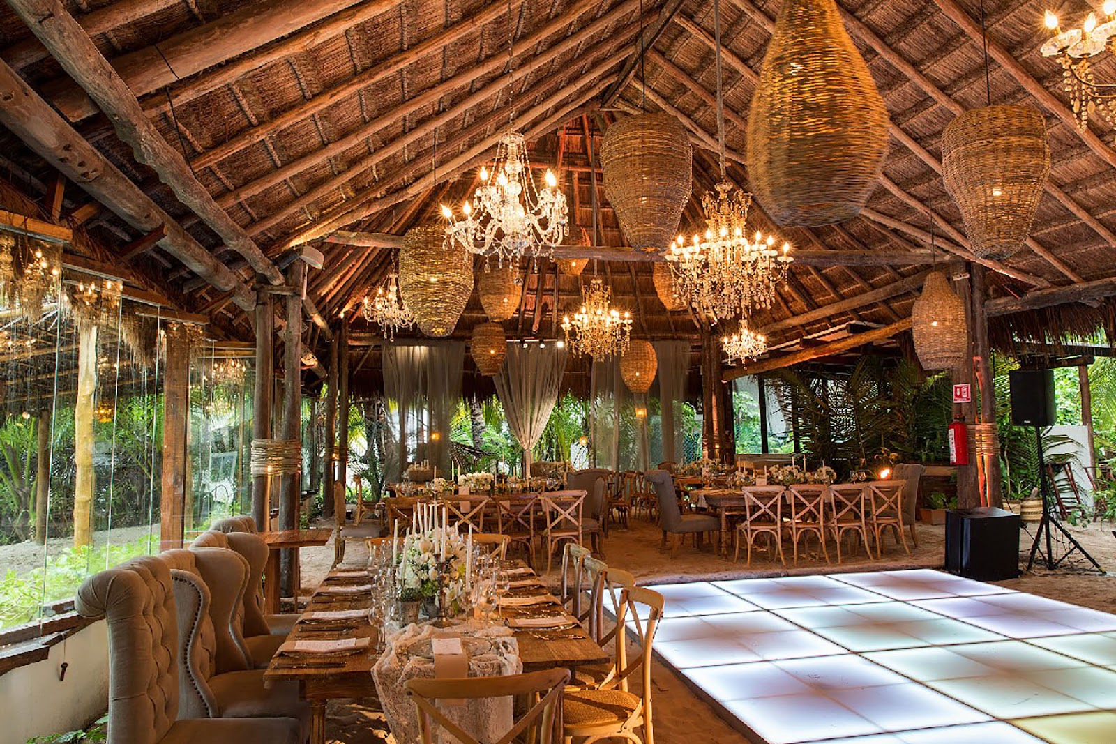 Thatched dining hall with rustic chandeliers