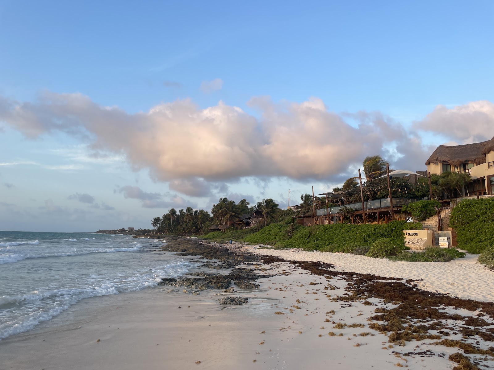 Tulum coastline under soft clouds at sunrise