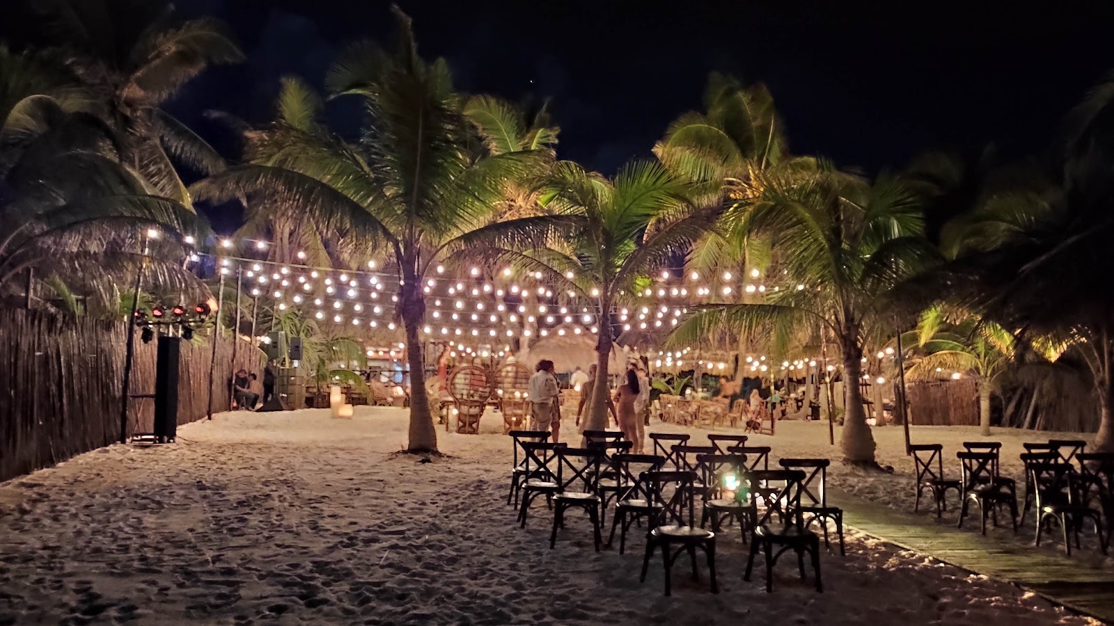 Tulumania dining area lit with string lights at night