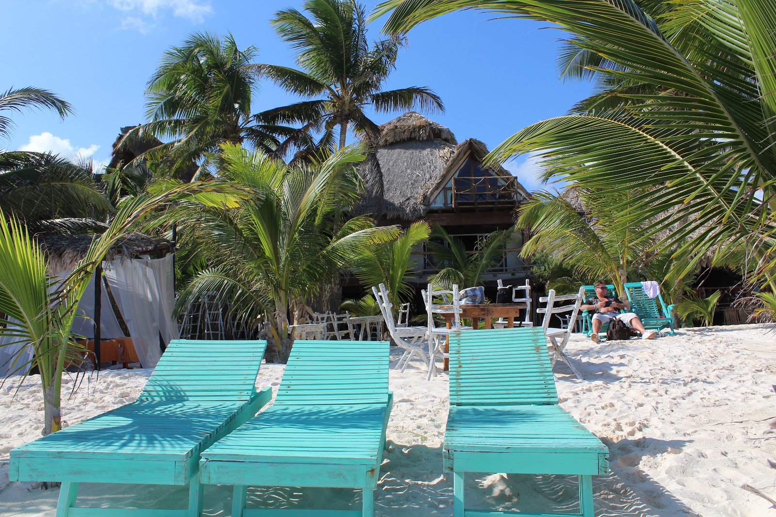 Turquoise sun loungers at Tulumania beach club