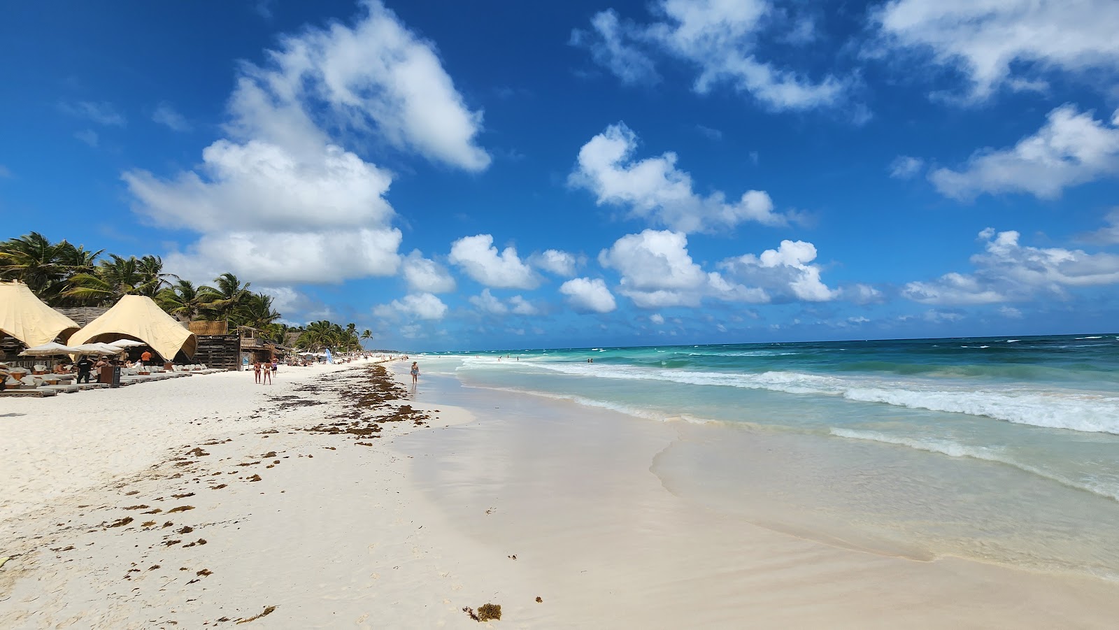 Turquoise sea and white sand beach under a blue sky