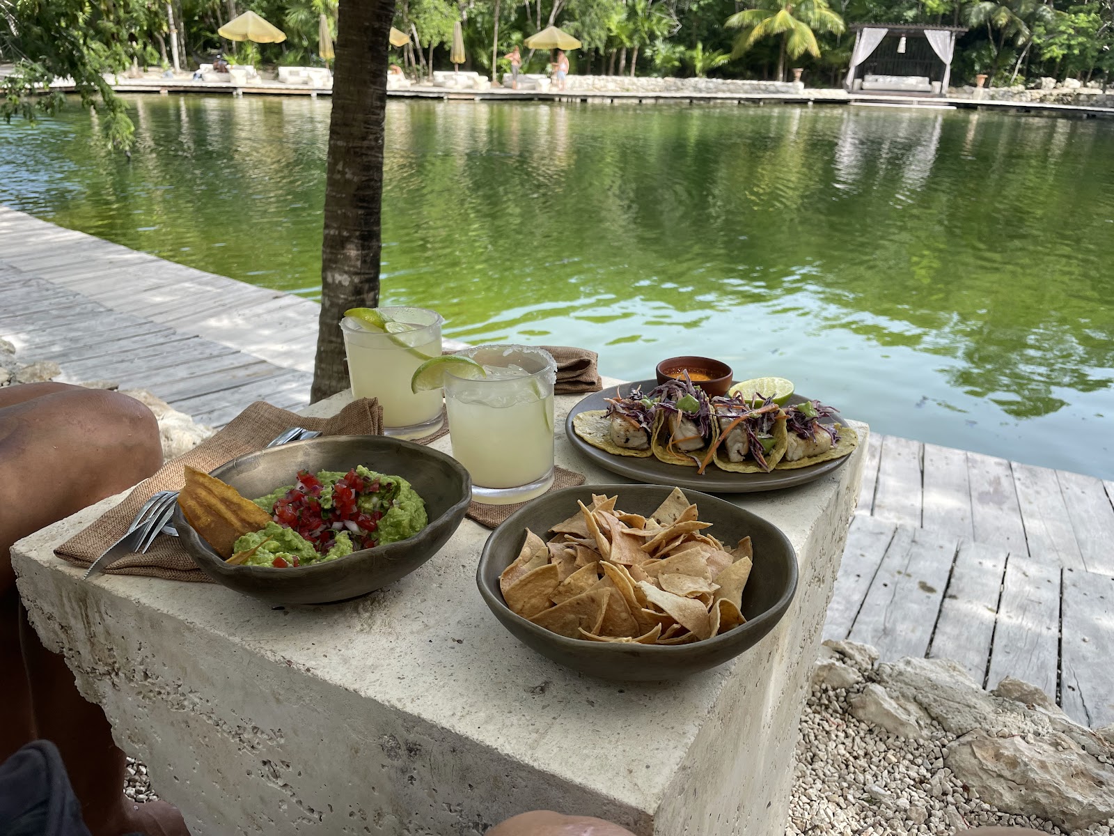 Vesica Tulum dishes served beside the cenote water