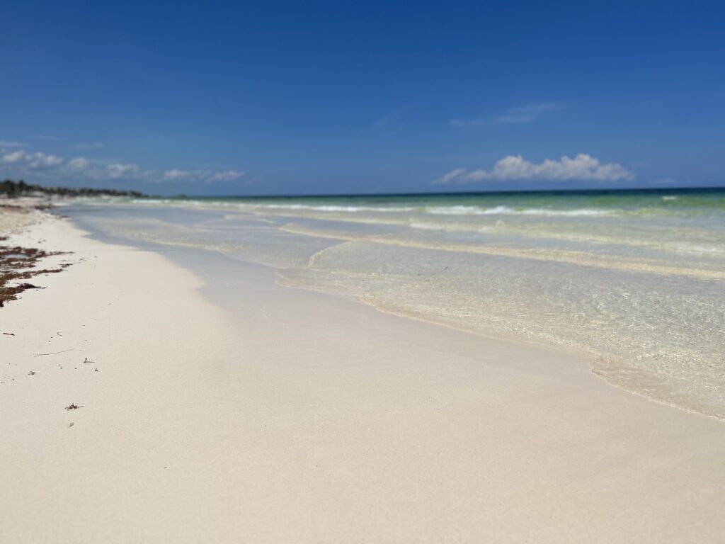 White sand beach and turquoise Caribbean water in the Tulum hotel zone