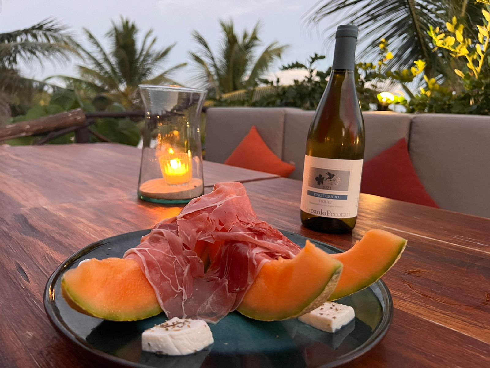 Bottle of white wine with fresh melon