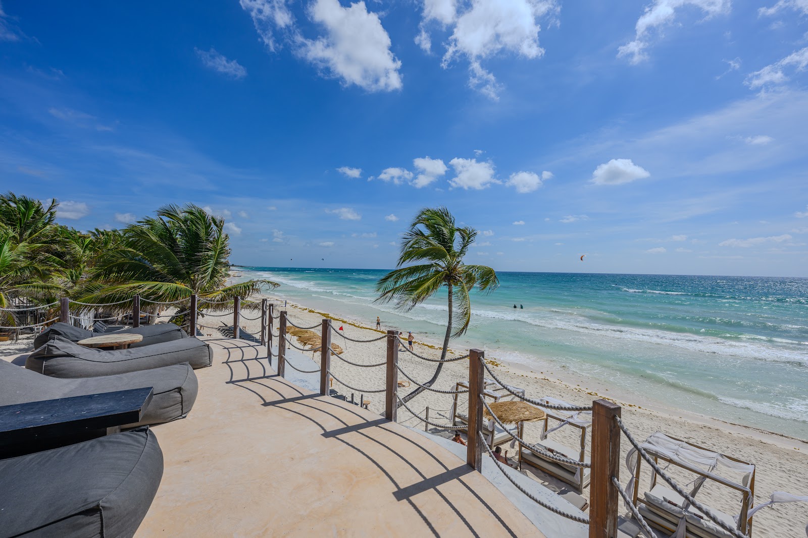 Wooden boardwalk leading to the beach on a sunny day