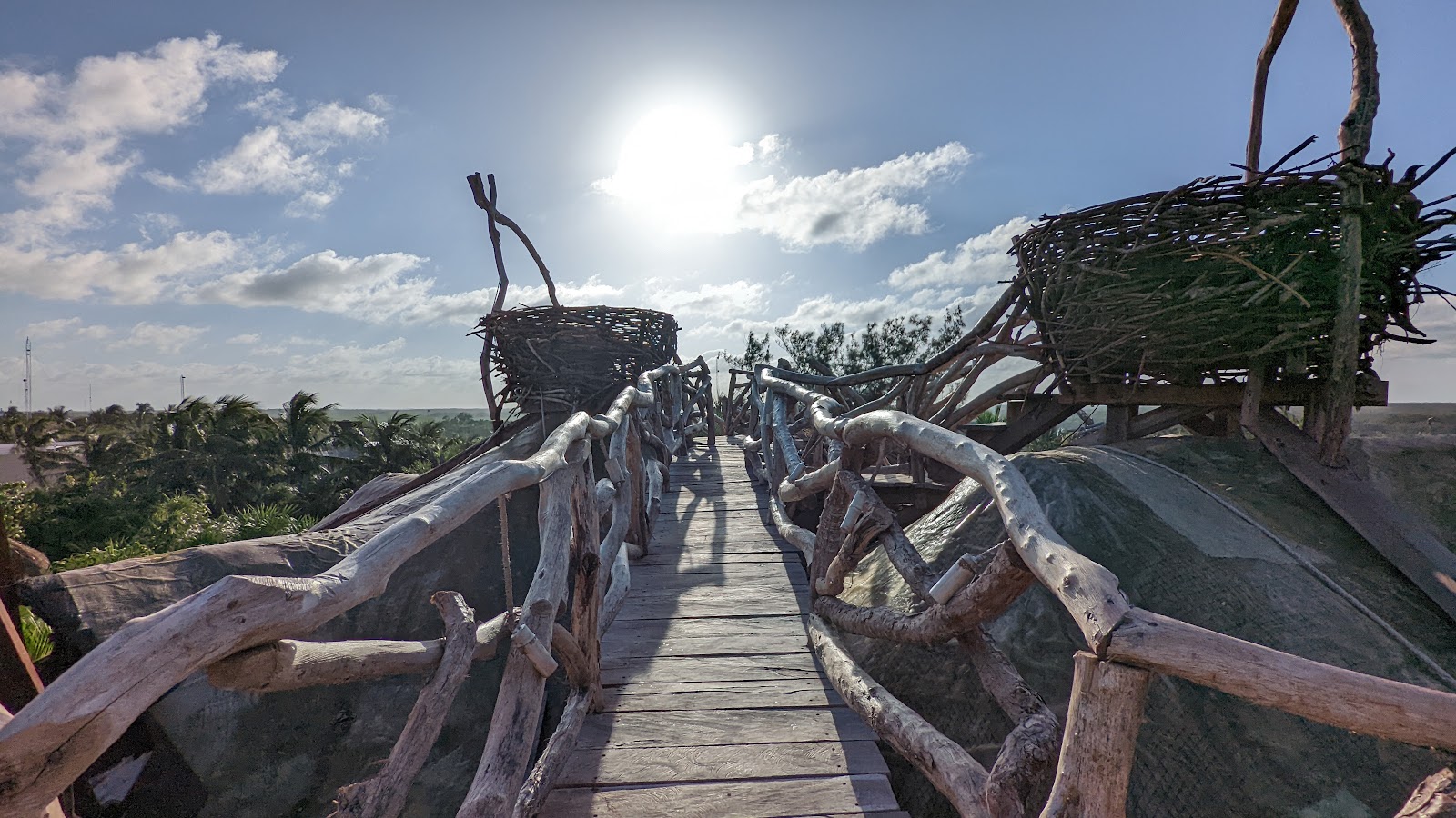 Wooden boardwalk leading toward the sea