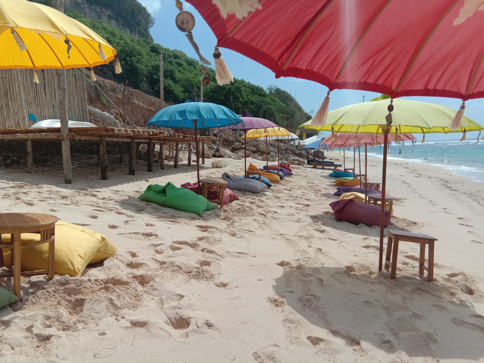 Colourful umbrellas and beanbags on the sand at Melasti Beach